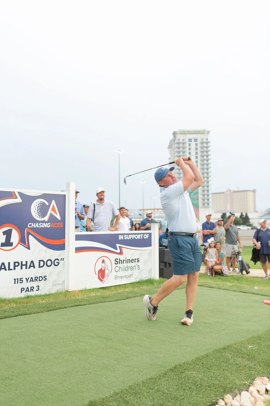 Golfer teeing off on Hole 1 at Chasing Aces